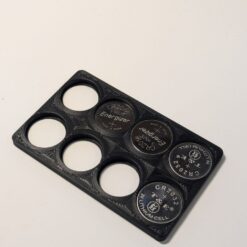 credit card battery holder with 8 CR2032 slots partially loaded